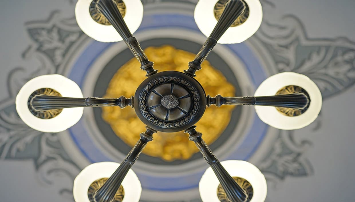 Under the painted ceiling