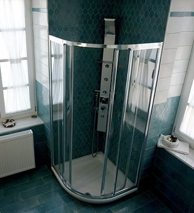 The hydromassage cabin in the teal-tiled bathroom of Nostos 5